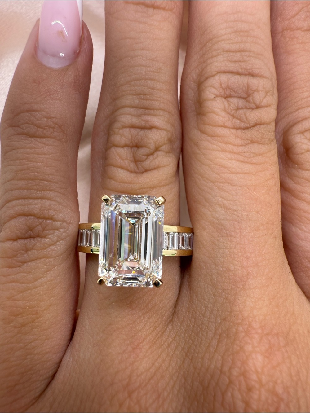 5.01 carat E VS1 emerald cut lab diamond on a channel set baguette band